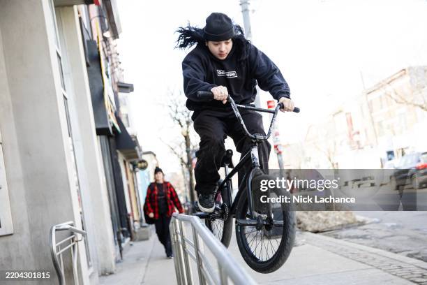 Toronto, ON Johnny Canard practices BMX tricks with friends on a warm afternoon. PD Nick Lachance/Toronto Star Nick Lachance/Toronto Star