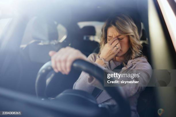 i have a terrible headache from this drive! - trött bildbanksfoton och bilder