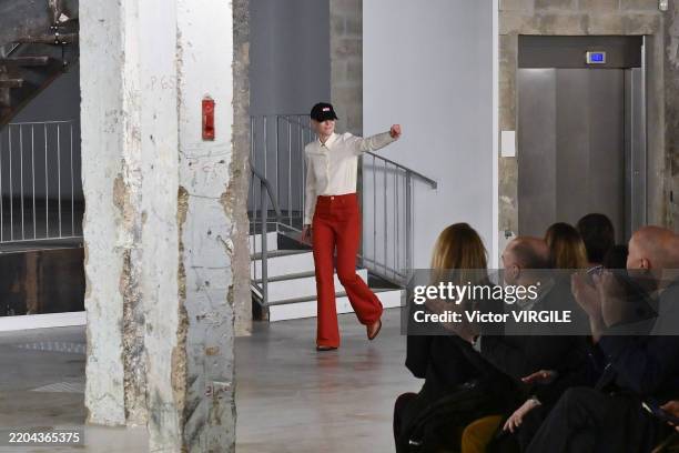 Fashion designer Gabriela Hearst wearing a ACLU cap walks the runway during the Gabriela Hearst Ready to Wear Fall/Winter 2025-2026 fashion show as...