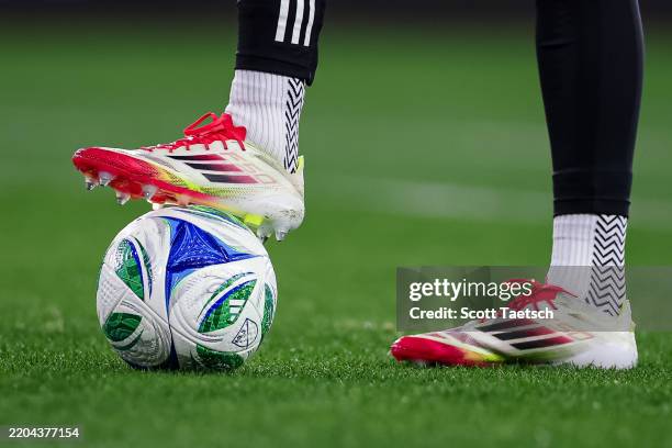 General view of the Adidas cleats worn by Ryan Schewe of Sporting Kansas City on a soccer ball before the MLS match against D.C. United at Audi Field...