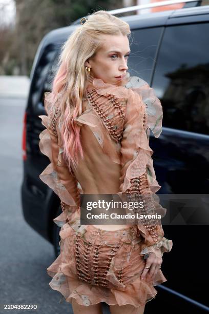 Lady Mary Charteris wears pink ruffled floral print mini dress with open back, gold earrings, outside Zimmermann, during the Womenswear Fall/Winter...