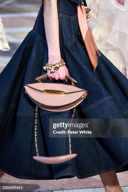 Model, bag detail, walks the runway during the Zimmermann Womenswear Fall/Winter 2025-2026 show as part of Paris Fashion Week on March 10, 2025 in...