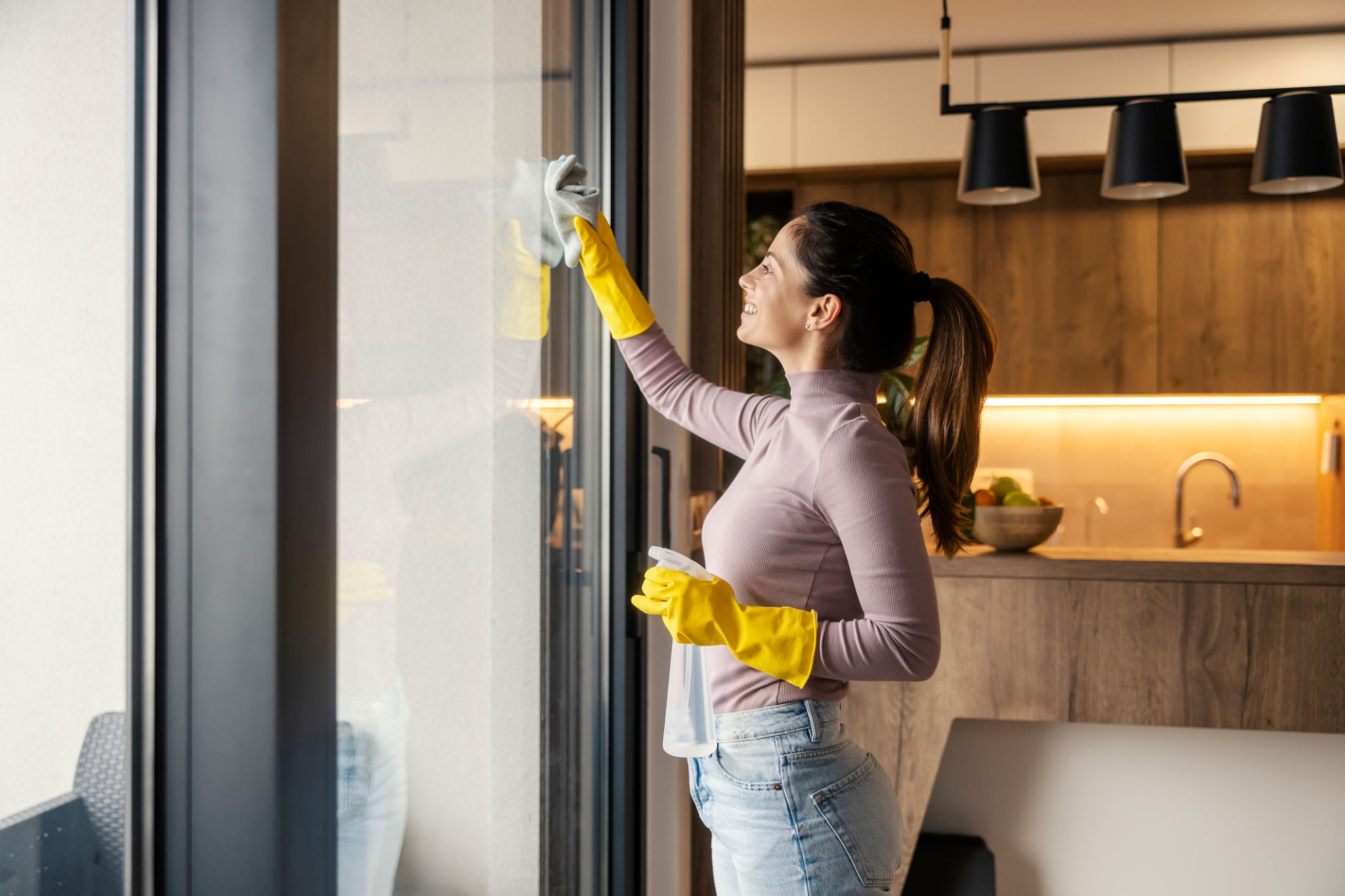 homeowner cleaning windows