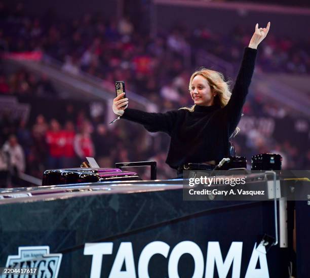 Madeline Arthur takes a selfie from the Zamboni during the first period between the Washington Capitals and the Los Angeles Kings at Crypto.com Arena...