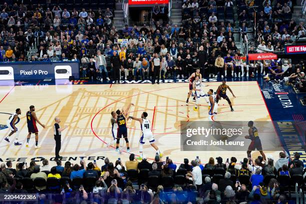 Stephen Curry of the Golden State Warriors shoots a three point basket to become the first player with 4,000 made three-pointers during the game...