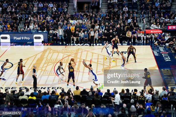 Stephen Curry of the Golden State Warriors shoots a three point basket to become the first player with 4,000 made three-pointers during the game...