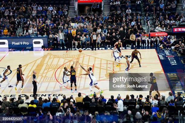 Stephen Curry of the Golden State Warriors shoots a three point basket to become the first player with 4,000 made three-pointers during the game...