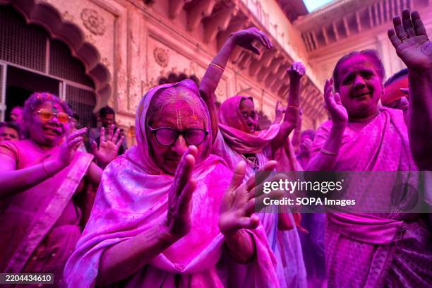 Widow devotees seen dance during a celebration of Holi or 'festival of colors' at Gopinath Temple in Vrindavan. Indian widows are breaking social...