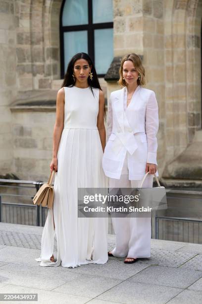 Ciinderella Balthazar and Nike Martens wear Akris at the Akris show during the Womenswear Fall/Winter 2025/2026 as part of Paris Fashion Week on...