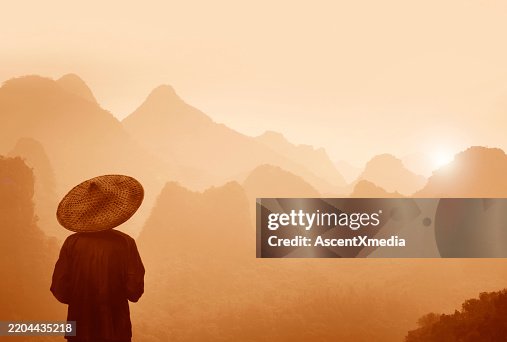 Guilin, Chinese farmer in big straw hat Guilin, Chinese farmer in big straw hat