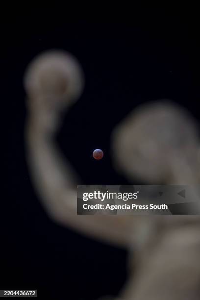 The full moon is seen during a total lunar eclipse on March 14, 2025 in Saltillo, Mexico. The "Blood Moon" is the first of its kind for the year, and...