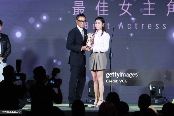 Actor Simon Yam Tat-wah presents Best Actress Award to Michelle Wai Sze-Nga during 2025 Hong Kong Film Directors' Guild Awards Ceremony on March 10,...
