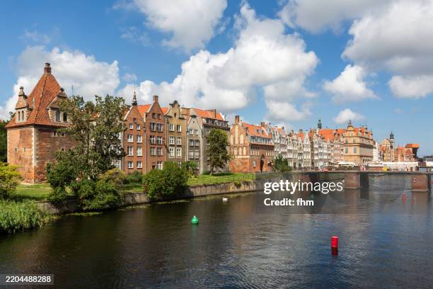 historic residential buildings next to a canal - gdansk stock pictures, royalty-free photos & images