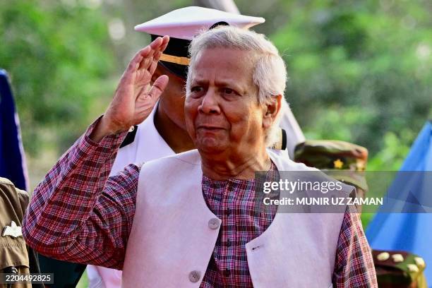 Chief advisor of Bangladesh's interim government, Muhammad Yunus gestures upon his arrival with the United Nations Secretary-General António Guterres...