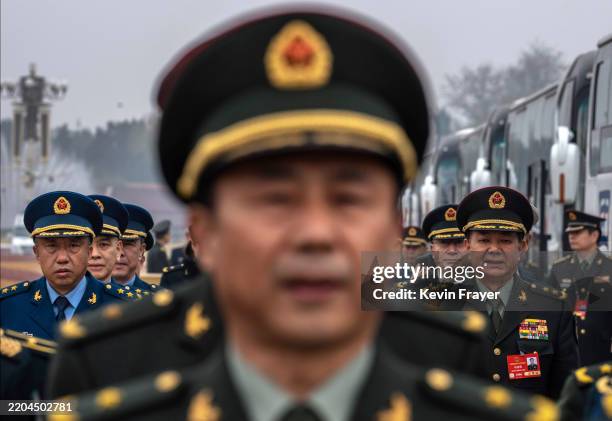 Delegates from the Chinese military line up before the closing session of the National Peoples Congress, or NPC, at the Great Hall of the People on...