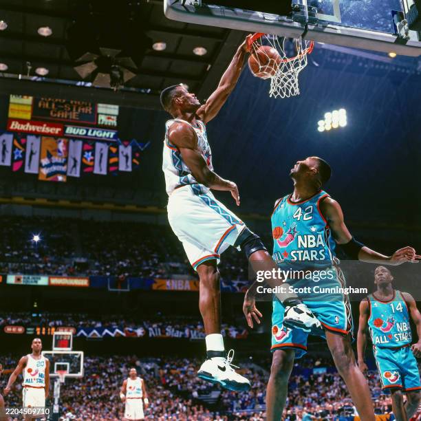 David Robinson of the Western Conference All-Stars dunks against the Eastern Conference All-Stars during the 1996 NBA All-Star game played February...