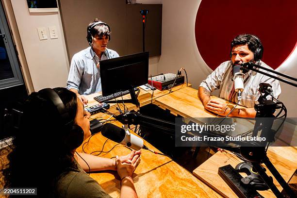 people talking during a podcast at studio - radio studio stock pictures, royalty-free photos & images