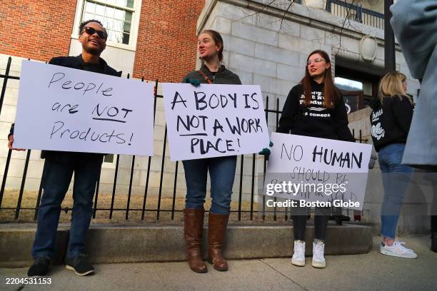 Cambridge, MA People demonstrate outside the Middlesex Juvenile Courthouse.