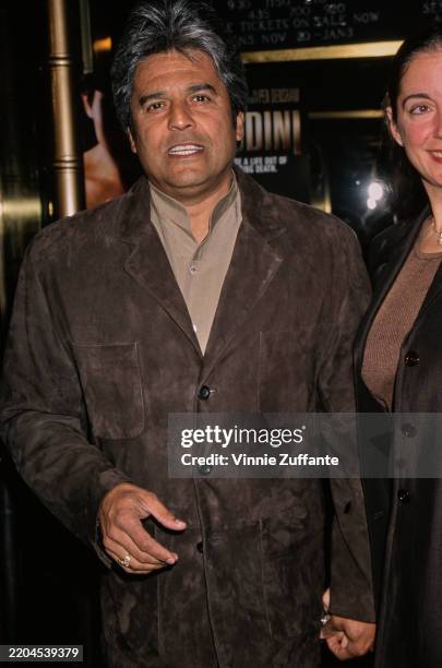 American actor Erik Estrada, wearing a brown suede jacket over a beige shirt, attends the Hollywood premiere of 'Houdini' at the El Capitan Theater...