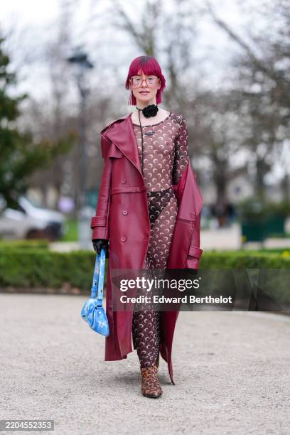 Guest wears burgundy bordeaux bang short hair, light pink sunglasses, black floral choker necklace, dark brown long sleeve sheer mesh Marine Serre...