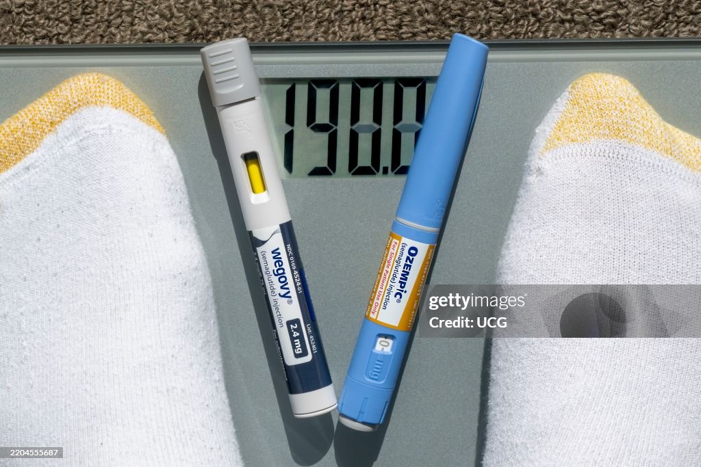Still life of Ozempic and Wegovy with weight scale.
