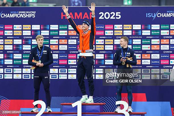 Second place US' Jordan Stolz, winner The Netherlands's Jenning De Boo and third place US' Cooper Mcleod celebrate with their medals on the podim...