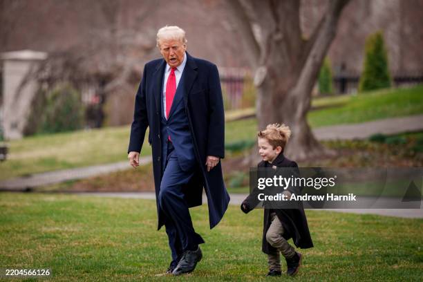 President Donald Trump and Æ A-Xii, the son of White House Senior Advisor, Tesla and SpaceX CEO Elon Musk, walk towards Marine One on the South Lawn...