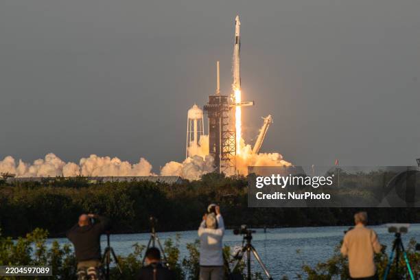 SpaceX Falcon 9 rocket lifts off from launch pad 30A at the Kennedy Space Center, carrying four astronauts to the Space Station.