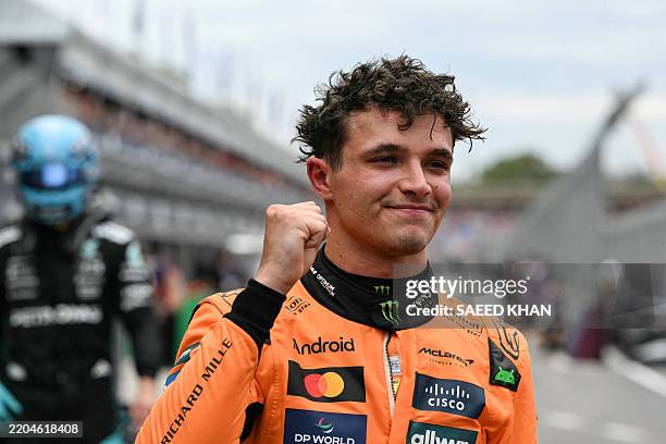 McLaren's British driver Lando Norris reacts after taking pole position following the qualifying session of the Formula One Australian Grand Prix at...
