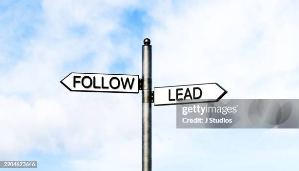 follow and lead: choosing your path - lead change stock pictures, royalty-free photos & images