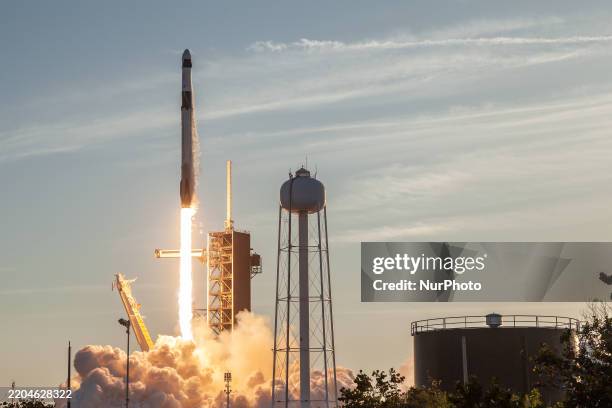 SpaceX Falcon 9 rocket lifts off from launch complex 39A at the Kennedy Space Center, carrying four astronauts to the International Space Station as...