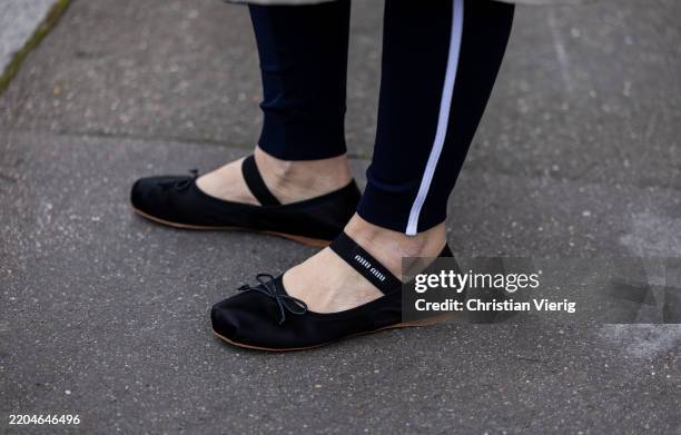 Erika Boldrin wears black flat shoes with logo outside Miu Miu during the Womenswear Fall/Winter 2025/2026 as part of Paris Fashion Week on March 11,...