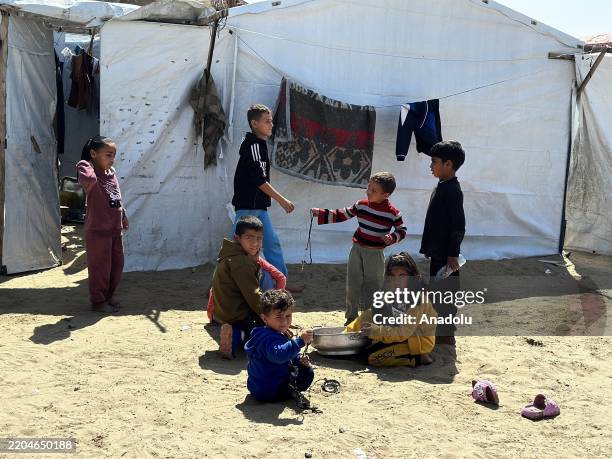 Children orphaned by Israeli attacks play near a shelter in the al-Baraka Orphan Camp , where children orphaned by Israeli attacks have been placed,...