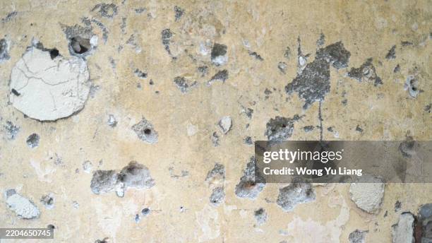 cracked bullet like wall - bombed wall stock pictures, royalty-free photos & images