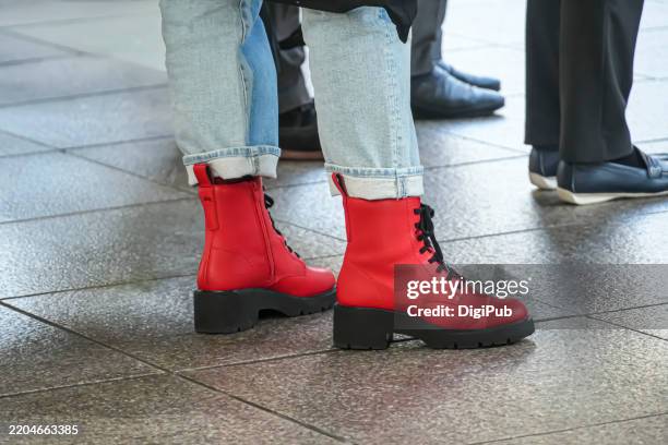 red lace-up ankle boots - red boot stock pictures, royalty-free photos & images
