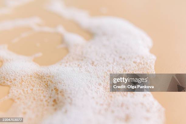 detailed close-up of foam bubbles on beige background - sea foam stock pictures, royalty-free photos & images