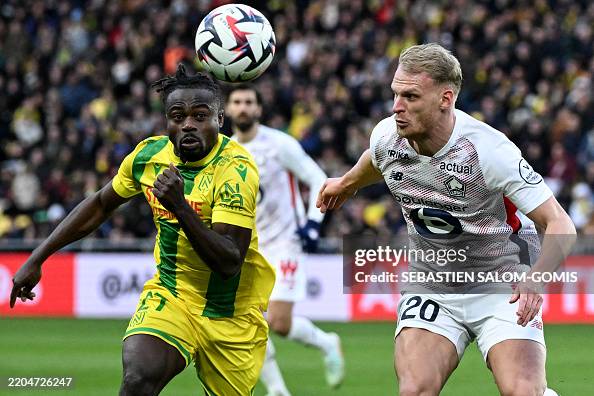 Forward Moses Nantes' Nigerian forward Moses Simon fights for the ball with Lille's ...