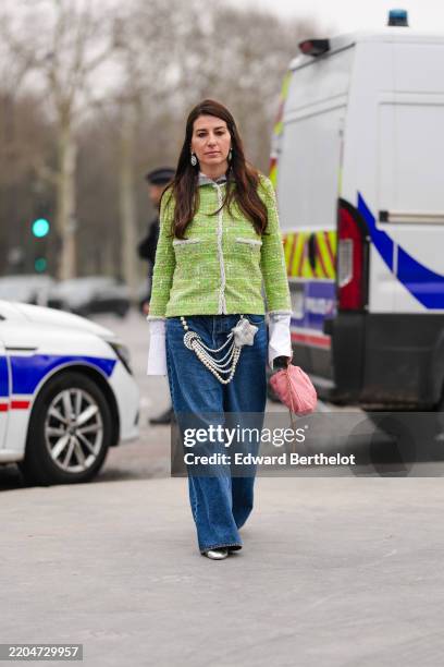 Guest wears silver Chanel earrings, bright green multicolor tweed Chanel blazer jacket, pear layered Chanel Belt, silver metallic star Chanel leather...