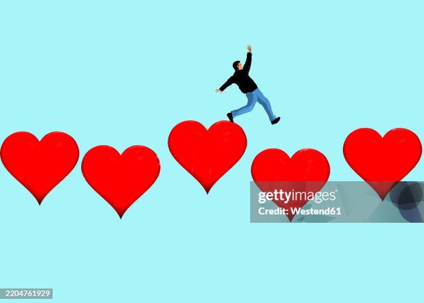 stockillustraties, clipart, cartoons en iconen met man tripping on hearts against blue background - verliefd worden