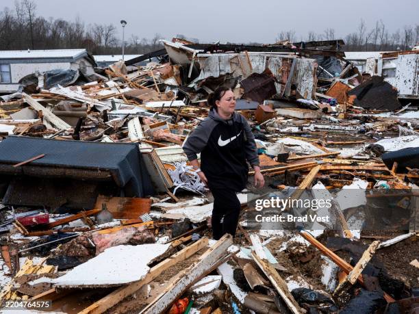 Stevie Kara searches for personal items after her home was destroyed on March 15, 2025 in Poplar Bluff, Missouri. Kara was at home when the storm...