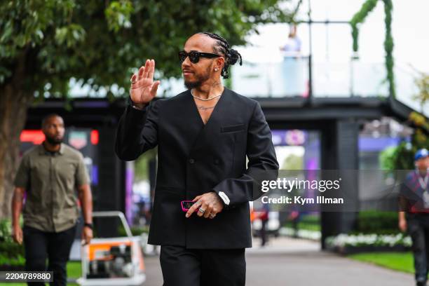 Lewis Hamilton of Great Britain and Ferrari walks in the paddock during previews ahead of the F1 Grand Prix of Australia at Albert Park Grand Prix...