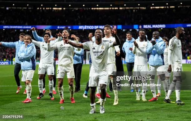 Vinicius Junior of Real Madrid celebrates victory with teammates after Real Madrid defeat Atletico de Madrid in the penalty shootout during the UEFA...