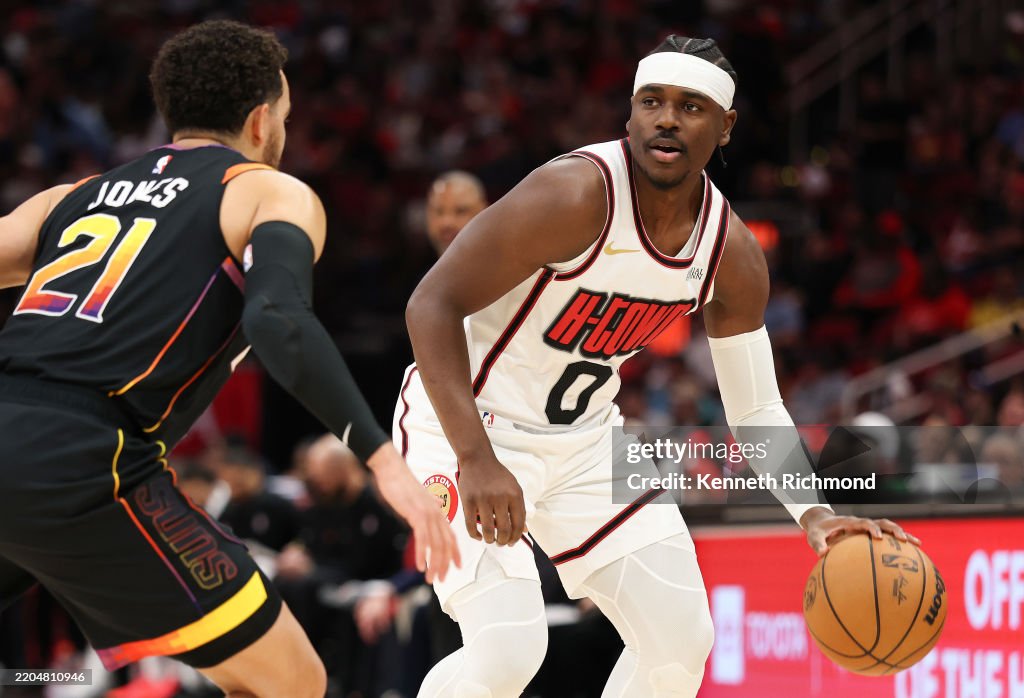 Jones Houston Rockets Aaron Holiday of the Houston Rockets drives against Tyus Jones of the ...