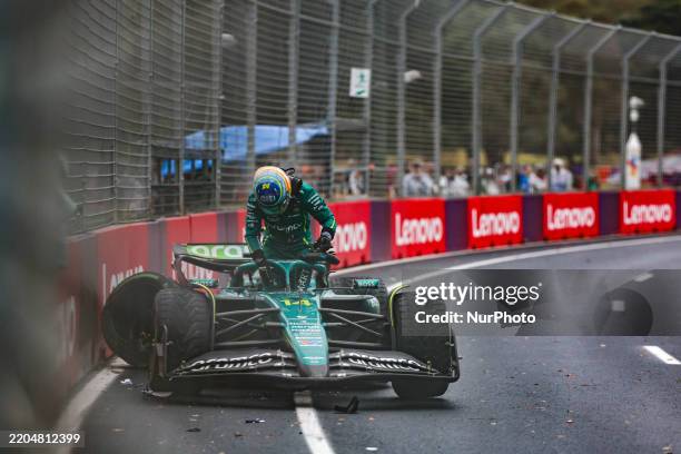 Fernando Alonso of Spain and the Aston Martin Aramco F1 Team crashes during the Race of the F1 Grand Prix of Australia at Albert Park Circuit in...