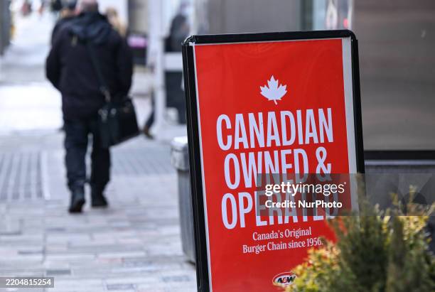 Sign reading 'Canadian Owned and Operated' is seen outside an A and W restaurant, a Canadian fast-food chain, in downtown Ottawa, Ontario, Canada, on...