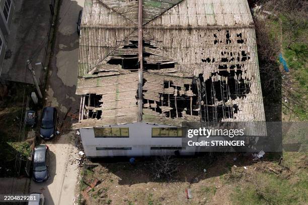 This aerial photograph shows a view of the burnt down nightclub in which revellers died, in Kocani, a town some 100 kilometres east of the capital...