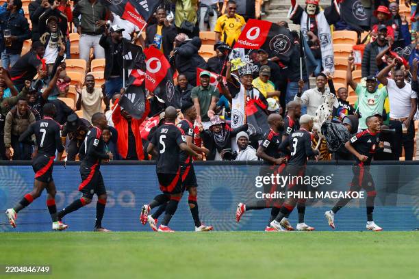 Pirates' South African forward Relebohile Mofokeng celebrates his goal during the Premier Soccer League South African Premier Division football match...