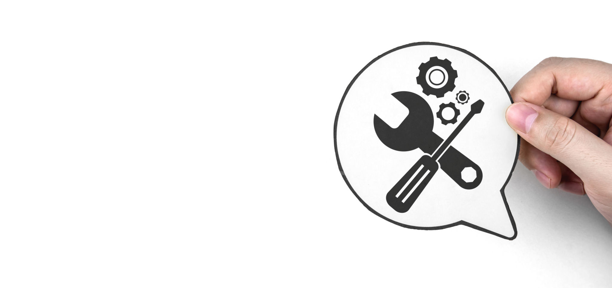 Hand holding paper with gear icon and mechanic tools. Concept of maintenance, process of maintaining and repairing equipment. Hand holding paper with gear icon and mechanic tools. Concept of maintenance, process of maintaining and repairing equipment.