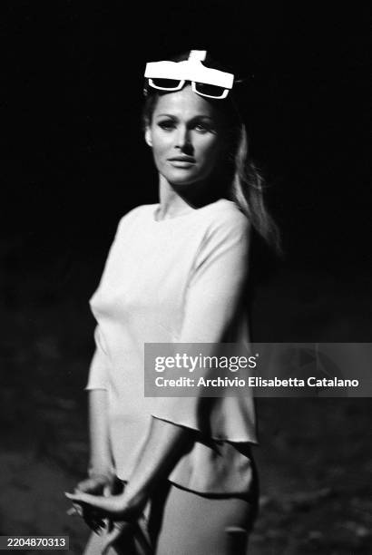 The Swiss actress Ursula Andress posing on the set of the film La Decima Vittima by Elio Petri, 1965