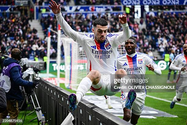 Lyon's Georgian forward Georges Mikautadze celebrates after scoring his team's third goal during the French L1 football match between Olympique...